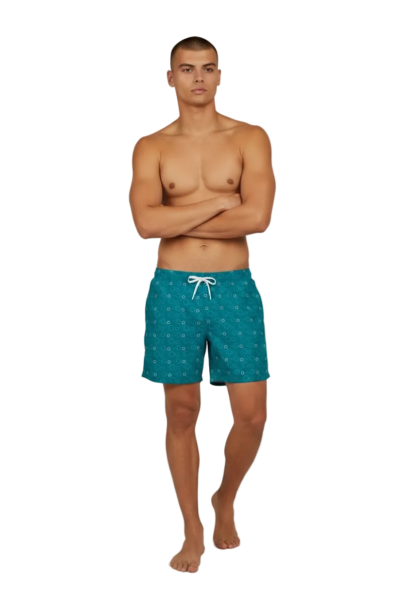 Red Sea Coast teal swim shorts, front view with arms crossed