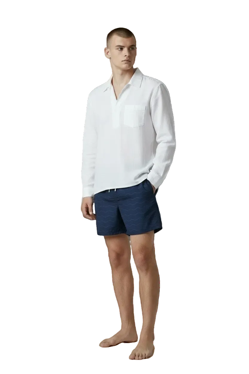 Classic Wave navy swim shorts styled with a white shirt, front view