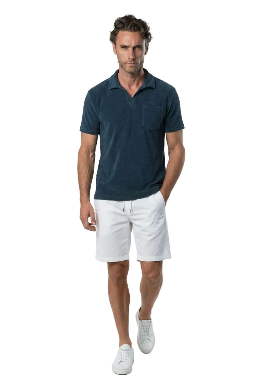 Bahr Towel Polo in navy terry towelling, worn with white shorts