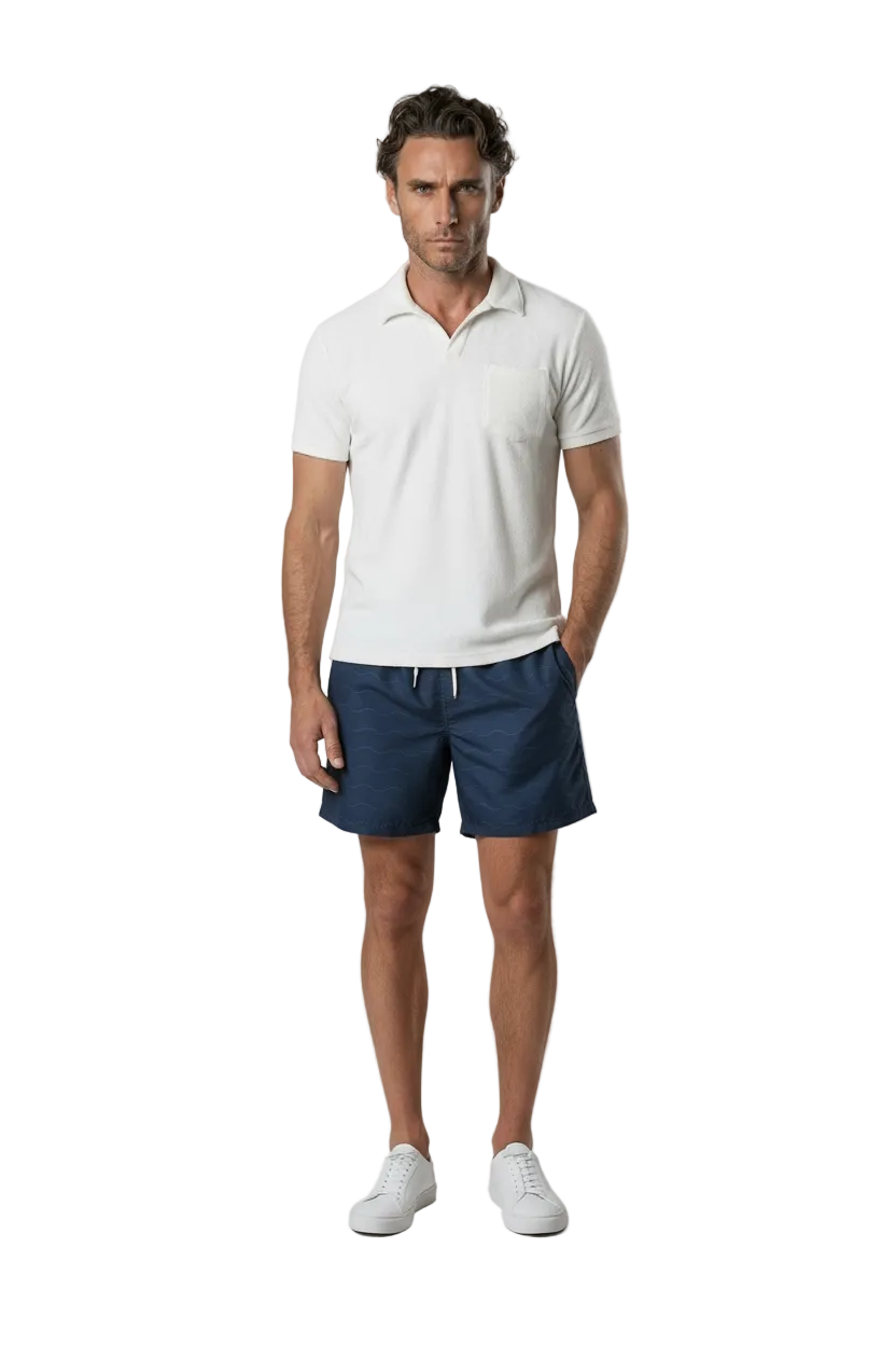 Bahr Towel Polo in white terry towelling, worn with navy shorts, front view