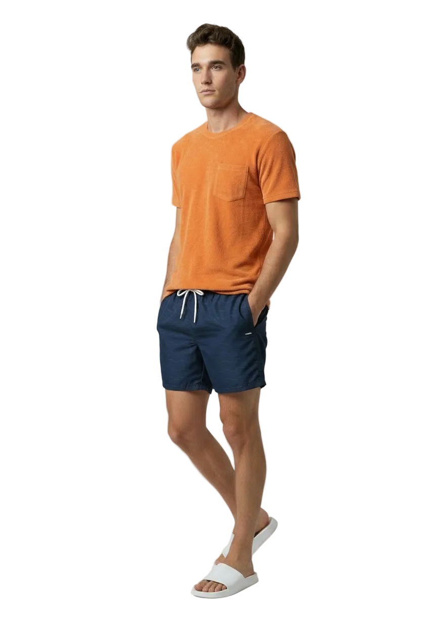 Bahr Towel Tee in sun orange terry towelling, worn with swim shorts, front view